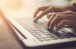 Image of hands using a keyboard