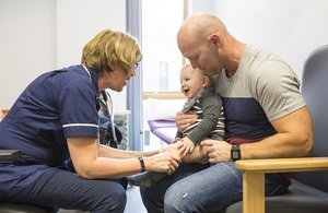 Nurse treating a toddler