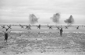 Troops land on a beach at Normandy, 75 years ago