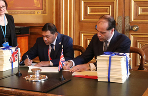 Minister Hollingbery (right) signs a trade continuity agreement with Eastern and Southern Africa (ESA)