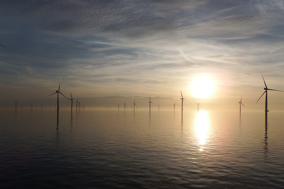 View of wind turbines at sea at sunset. (Copyright: Gwynt Y Mor wind farm, Rory McKerrell, RWE Innogy)