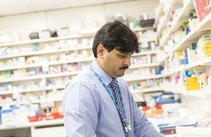 Close-up of pharmacist working in a pharmacy.