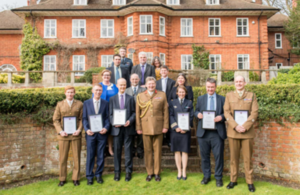 Commander JFC, General Sir Chris Deverell, stood with a group of Commendation recipients.