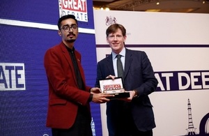 The winner, Haris Ali Virk from Government College University Lahore receiving trophy from Acting British High Commissioner, Richard Crowder.