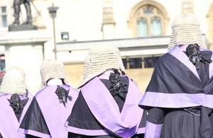 Judges walking in a line in their wigs and gowns