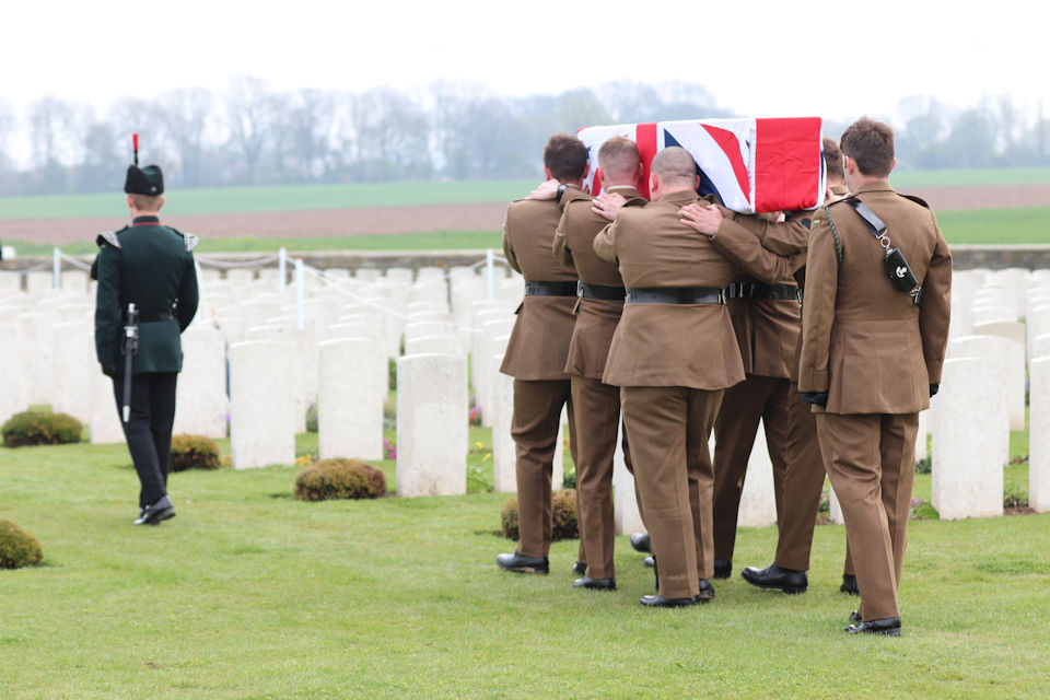 A bugler and bearer party from1 RIFLES carry Private Burt’s to the graveside, Crown Copyright, All rights reserved
