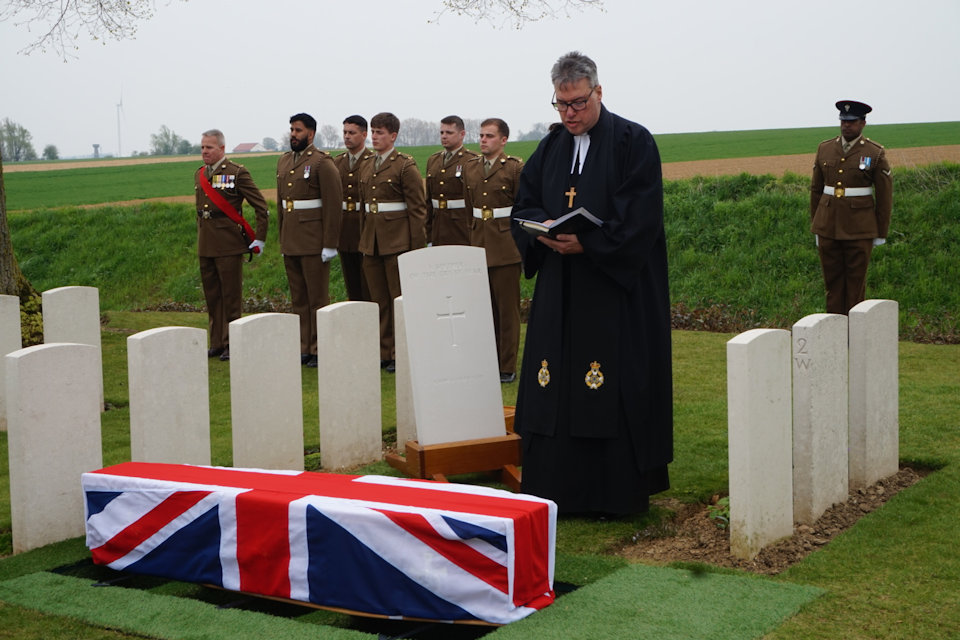 The Reverend Tim Flowers conducts the burial service at the graveside of the unknown soldier in Guards Cemetery, Lesboeufs, Crown Copyright, All rights reserved