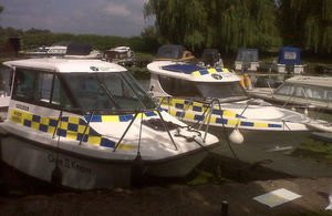 Two Environment Agency patrol boats on the river