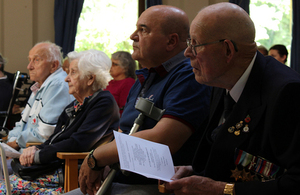 Residents look on during the memorial service. MOD Crown Copyright.