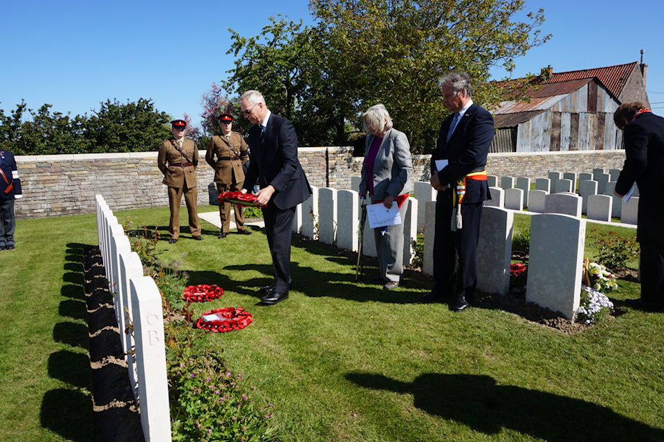 Geoffrey Tuff lays a wreath at the graveside of his great uncle Capt Tuff at Oosttaverne Wood Cemetery, Crown Copyright 