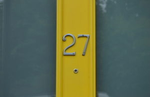 Close up of front door with number 27 on it