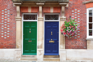 Front doors of terraced houses on a residential estate.
