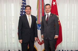 Defence Minister Mark Lancaster meets US Secretary of the Army Dr. Mark T. Espern. They are both pictured smiling at the camera.