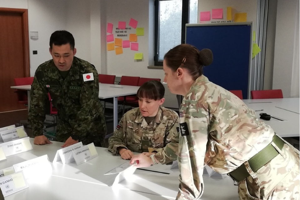 Lt Col Kawano (Japan), SSgt Slane (UK) and Sgt James (UK) plan assessment groups