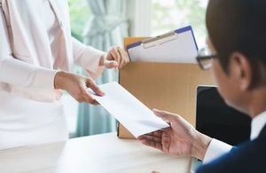 Man being given a redundancy letter