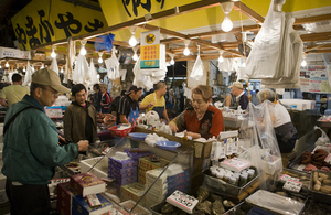 Customer makes purchase at fishmonger stall
