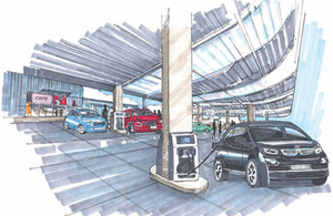 Artist impression of an electric chargepoint forecourt, with electric vehicles parked at charge points