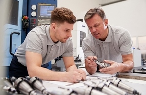 Manufacturing environment with two men
