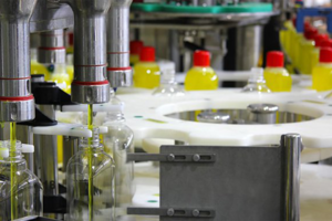 Chemical bottles being filled on a factory line