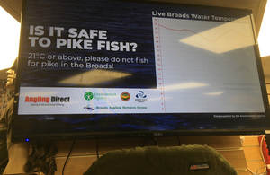 A sign asking anglers if it is too hot to fish for pike