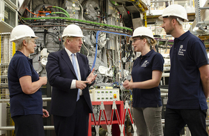 Prime Minister Boris Johnson at the MAST Upgrade fusion experiment with UKAEA staff (left to right): Nanna Heiberg, Stephanie Hall and Matthew Carr.