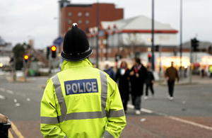 Police officer observing town centre