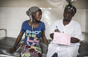 Picture showing woman receiving family planning advice and supplies.