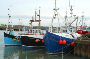 Three UK fishing vessels in a port
