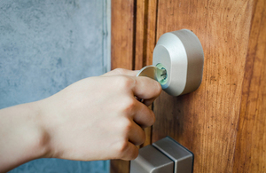 Image of person locking door