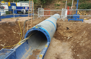 image showing a tunnelling machine breaking through underneath the A38
