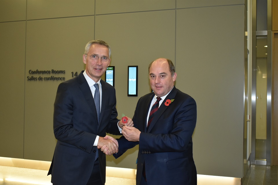 Defence Secretary Ben Wallace presents NATO Secretary General Jens Stoltenberg with a poppy