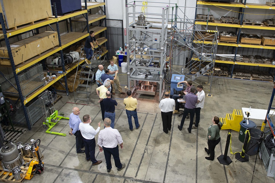 An overhead view of the HIP rig in America, with various observers standing around 