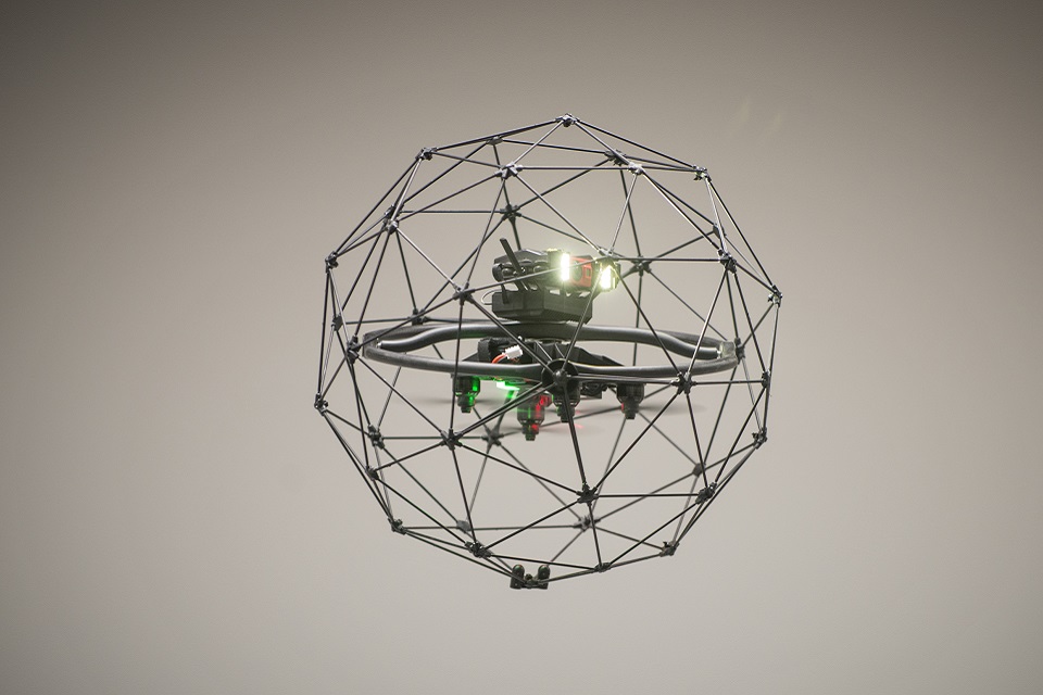 An in-flight drone, shaped like a sphere