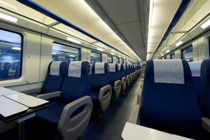 Photograph of seats inside a train carriage.