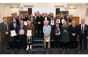 Sanctuary Award winners celebrate at awards ceremony. A picture of winners holding awards.