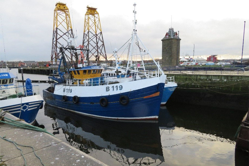 Fishing vessel Illustris alongside another fishing vessel