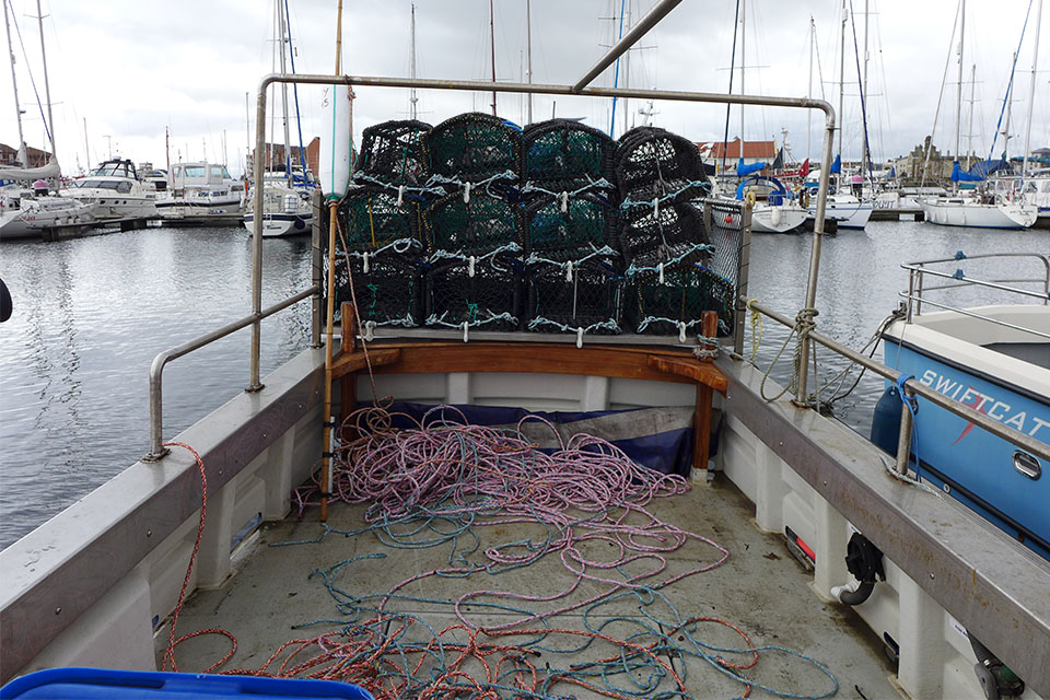 Loose ropes scattered on deck of fishing vessel