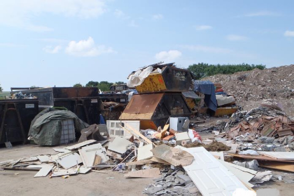 Piles of unspecified waste stored outside the permitted area and not in a secure container