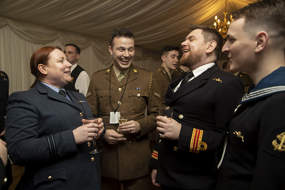 Members of the three Services enjoying the LGB20 reception in the House of Commons terrace. 