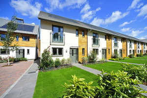 photo of new housing with green lawns