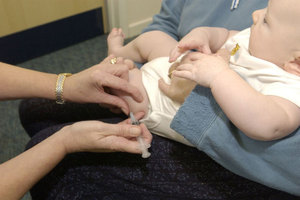 Child being vaccinated in the leg
