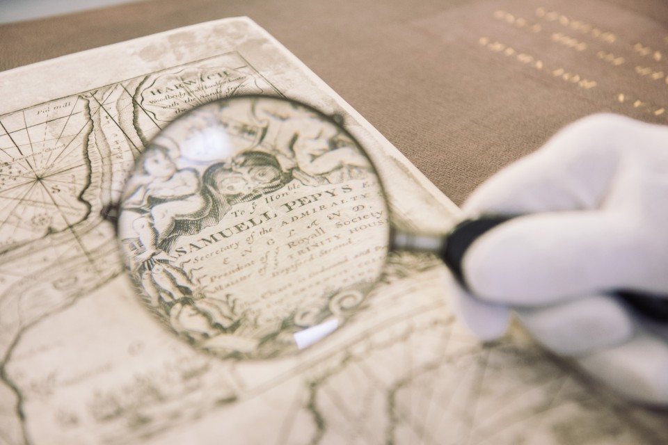 Magnifying glass over a historical chart