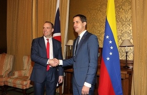 Foreign Secretary Dominic Raab shaking hands with the Venezuelan Interim-President Juan Guaidó