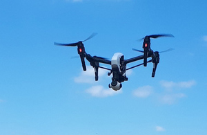 Drone airborne in blue sky