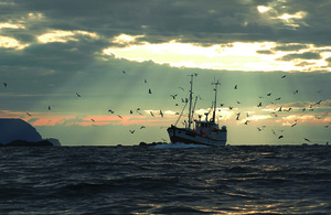 fishing vessel at sunset