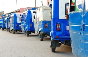 Mini vans queued on a road