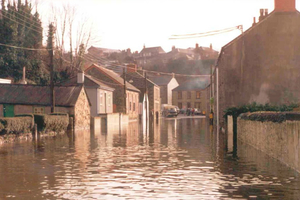 Photograph showing floodwater in St Johns Road, Helston, 22 January 1988