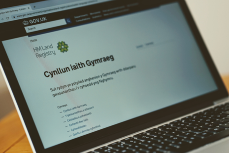 A laptop displaying HM Land Registry's Welsh language scheme.