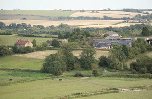 Rural buildings surrounded by fields and trees