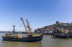 Whitby harbour with fishing boat